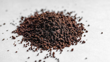 Black Tea powder on a white background