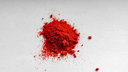 Red chili powder on a white background