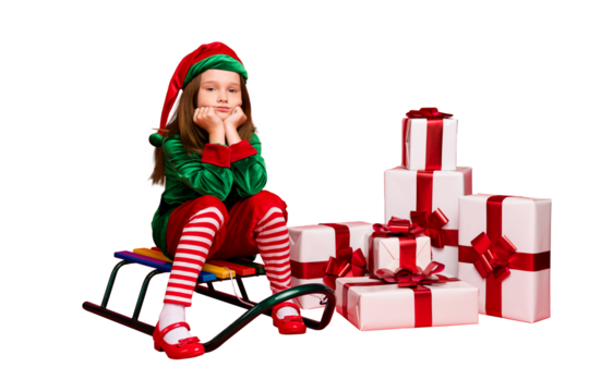 Portrait of her she nice attractive charming tired overwhelmed pre-teen elf Santa Claus apparel look outfit sitting on sled pile stack boxes delivery isolated over bright vivid shine red background