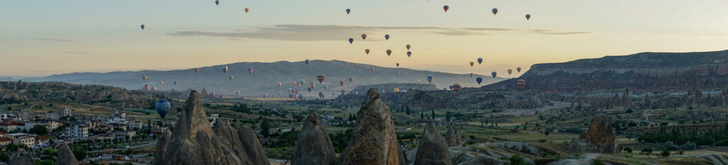 Hot air balloons rising early in the morning