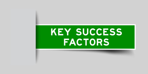 Green color square shape sticker label with word key success factors inserted in gray background