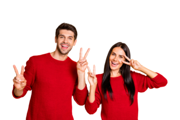 Portrait of beautiful married couple make v-signs wear red jumer isolated over yellow background