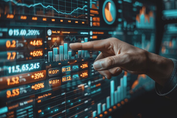 Fototapeta premium Hand pointing at financial chart displayed on digital screen showing stock market analysis.