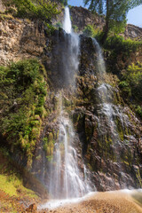 Close-up shots of a beautiful waterfall view in the mountain.