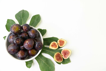 Organic figs, freshly harvested and cut into fig leaves