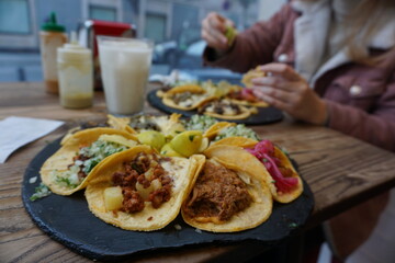 Taco plate, latin food, people eating in restaurant