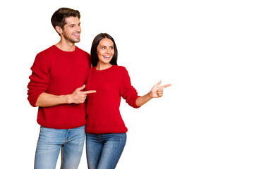 Profile side photo of two charming people point at copy space show promo wear red sweater denim...