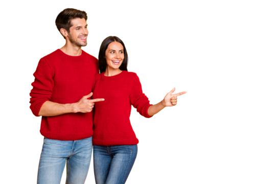 Profile side photo of two charming people point at copy space show promo wear red sweater denim jeans isolated over yellow background