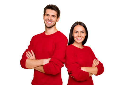 Portrait of cheerful couple with hands crossed wear red sweater isolated over yellow background