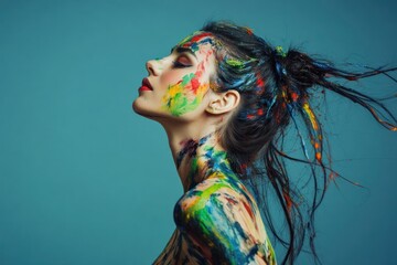 Naklejka premium Profile of woman with vibrant paint splashes