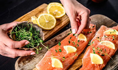 Girl decorating at fillet trout red fish