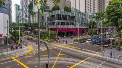 Aerial view of sidewalk and intersection of Orchard road in Singapore timelapse hyperlapse.