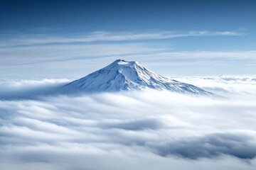 A distant snow-capped volcano rising above the clouds