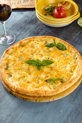 Delicious Four Cheese Pizza Quattro Formaggi with Fresh Basil Toppings