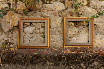 Vintage wooden frames decoration at the stone wall, copy space 