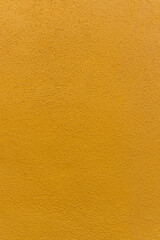 Golden yellow plaster wall texture 
