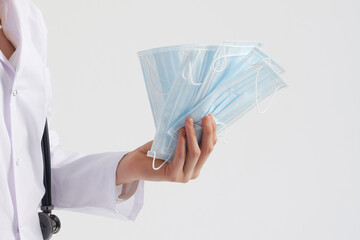 Doctor or nurse recommend to use protective face mask to protect from virus infection, coronavirus...