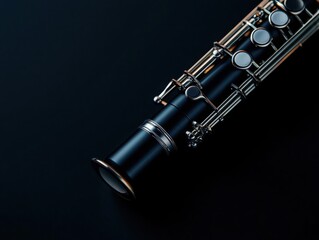 Close-up of a clarinet showcasing its intricate details and polished finish against a dark background.
