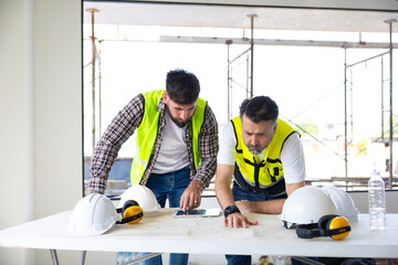 blueprint. Builders and architect looking at plans. employees in construction industry