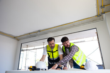 blueprint. Builders and architect looking at plans. employees in construction industry