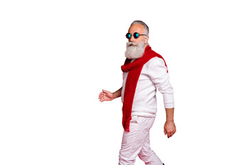 Portrait of his he nice attractive handsome content classy chic gray-haired man wearing pullover sweater walking season trend isolated over bright vivid shine red background