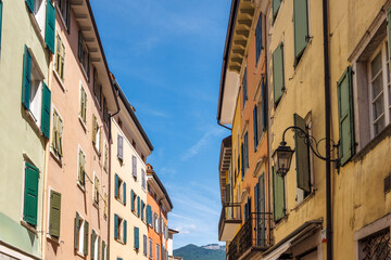 Colorfull buildings in a street of the Riva del Garda, town on the shores of Lake Garda, Italy, Europe.
