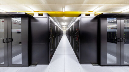 Network servers in a data center. Tier III carrier neutral data center. Server rooms.
