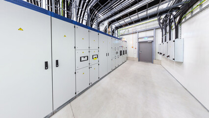 Network servers in a data center. Tier III carrier neutral data center. Electrical distribution room. Switchboard.