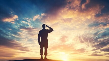 Silhouette of a soldier saluting with dramatic clouds in a sunset sky.