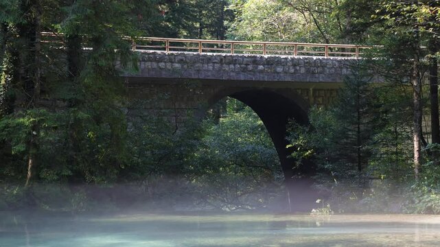 Bridge Over Kamni&scaron;ka Bistrica with Steam Rising from Clean Flowing Water