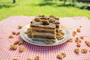 Gerbeaud cake also called Zerbo Rez in Slovakia and Czechia or zserbó szelet in Hungary served on small table outside