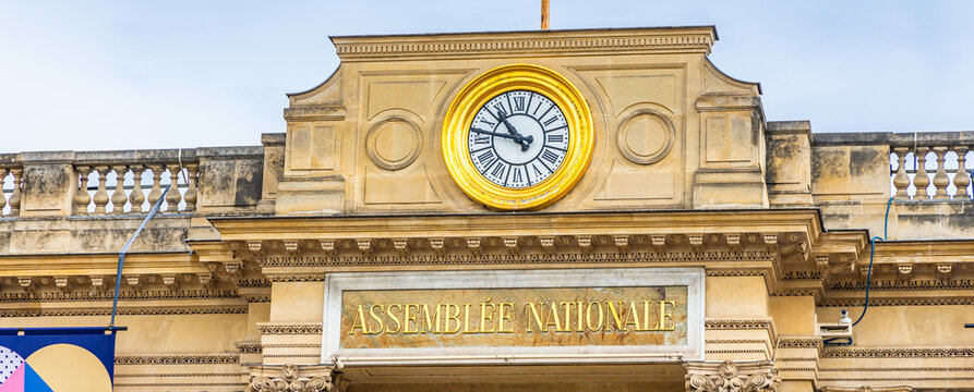 Clock and name of Assemblee Nationale at the entrance of the building in Paris, France