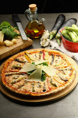 Gourmet Italian pizza with premium ingredients: rich tomato sauce, melted mozzarella, and a blend of fine cured meats. Finished with fresh basil and a drizzle of truffle oil for an elegant touch.