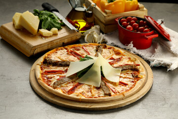 Gourmet Italian pizza with premium ingredients: rich tomato sauce, melted mozzarella, and a blend of fine cured meats. Finished with fresh basil and a drizzle of truffle oil for an elegant touch.