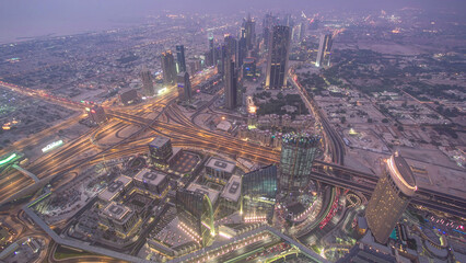 Dubai downtown day to night transition with city lights from above timelapse