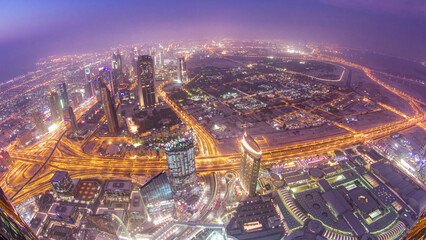 Dubai downtown day to night transition with city lights from above timelapse