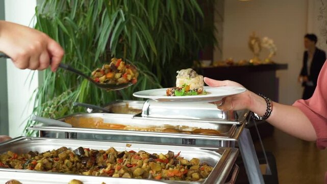 People group catering buffet food indoor in luxury restaurant with meat colorful fruits and vegetables. Close up. Banquet, lunch, catering buffet.