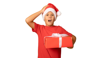 Portrait of a surprised child in Santa red hat holding Christmas gift in hand over transparent background. Christmas concept.