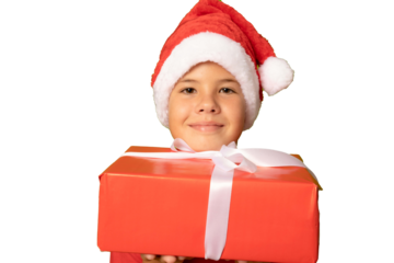 Close up smiling beautiful child in Santa red hat holding Christmas gift in hand over transparent background. Christmas concept.