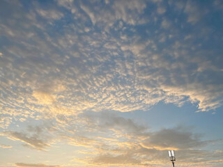 Beautiful cloudy sky view with goldensunlight.