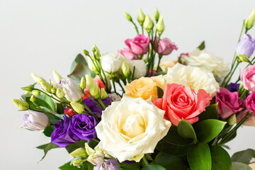 Celebrate special occasions with a colorful summer bouquet featuring fresh roses, eucalyptus, and eustoma blooms, creating an elegant and fragrant floral arrangement