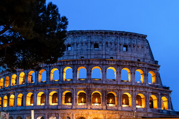 Obraz premium Rome, Italy - April 09, 2024: View of the Roman Coliseum in Rome with tourists crowding its surroundings in Rome, Italy