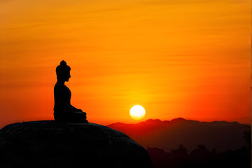 buddha silhouette on golden sunset background beliefs of Buddhism
