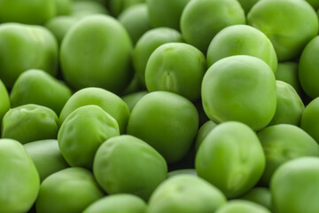 Fresh raw green peas as background, closeup