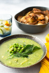 Creamy broccoli and green pea soup with mint, baked chicken with pears and thyme, delicious healthy lunch