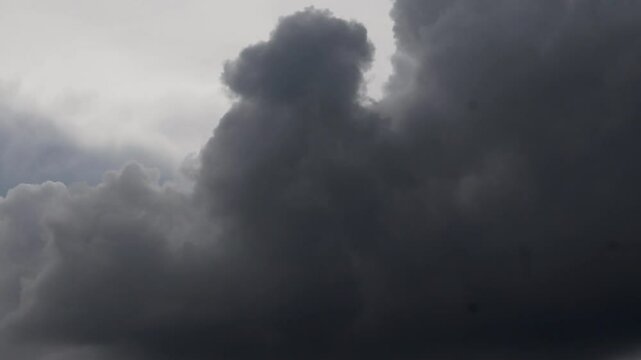 dark storm clouds are moving fast at viewer - timelapse, 4k