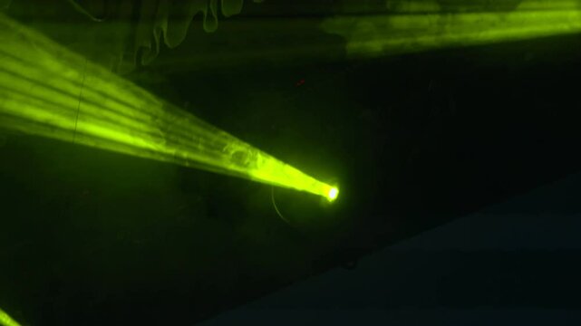 The flashlight beam moves in complete darkness