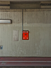 red SOS alarm system for emergencies installed in a tunnel