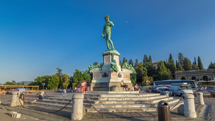 Fototapeta premium Bronze copy of the statue of David by Michelangelo at Piazzale Michelangelo timelapse hyperlapse in Florence