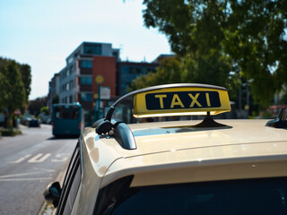 detail shot of a taxi sign in Germany on the inside of the car with defocused background
